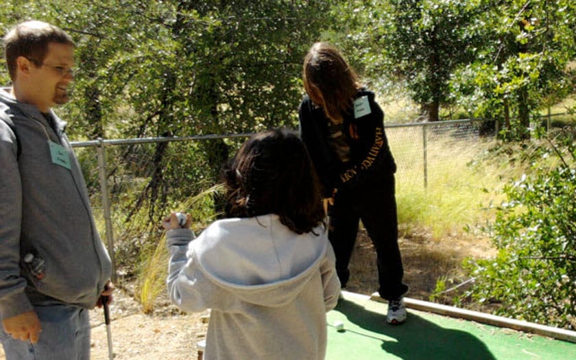 Students playing mini golf
