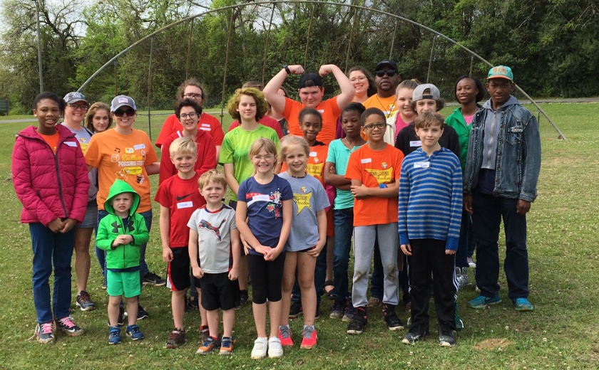 ALCA families pose for a group picture on field day