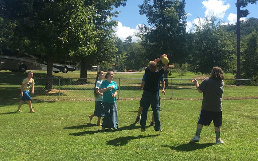 Playing football together at the Back to School Bash
