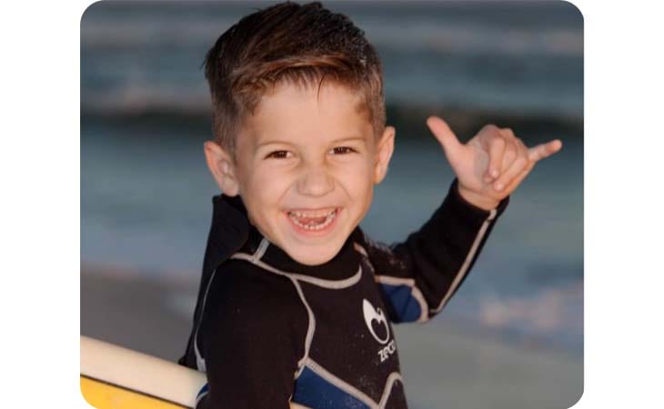 Image of Jaxon from Alabama Connections Academy enjoying some surf. 