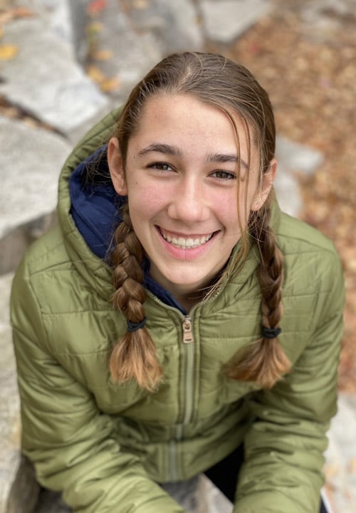 Maddie in a green coat