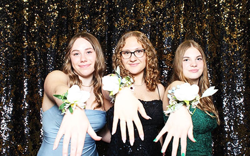 3 Minnesota Connections Academy students showing off their corsages at Prom!