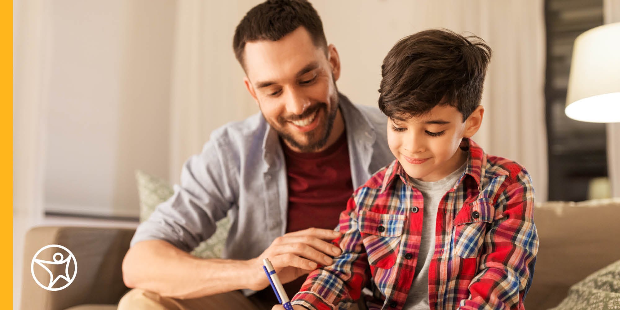 Connections Academy student working with his learning coach father on an online assignment. 