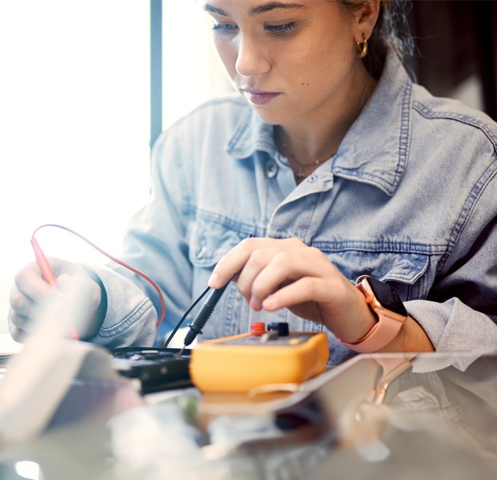 A high school student engaging in a semiconductor activity