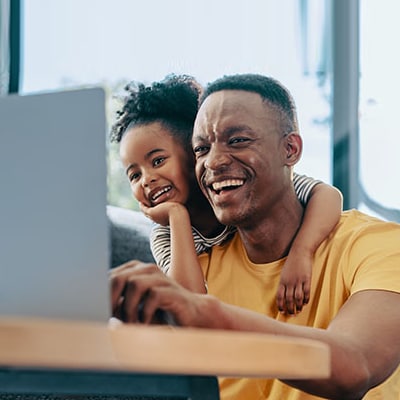 Three happy students walking on a street